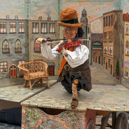 Portugal, Porto. Puppet show on one of the pedestrian streets. Poor violinist.のeditorial素材