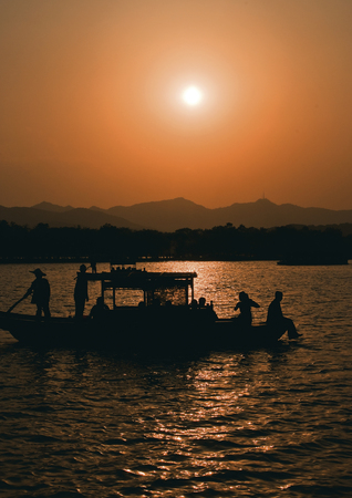 China, Hangzhou. Paradise in heaven and on earth - Hangzhou and Suzhou - Chinese proverb . Sunset at West Lake (Xihu)- Hangzhou main attractions .の写真素材