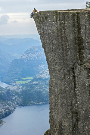 Norway, Lysefjord. The Pulpit Rock- Prekestolen - the height of the water level to six hundred and four meters. Self-portrait, shot with a tripod.のeditorial素材