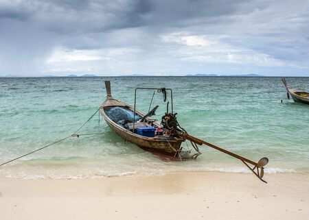Thailand, Krabi Province. Fishing village on one of the many islands in the sea. Fishing boats...