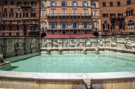 Italy. Fonte Gaia - a fountain in Siena. This fountain is situated on the main square in Siena, Piazza del Campo, opposite the Palazzo Pubblico.のeditorial素材
