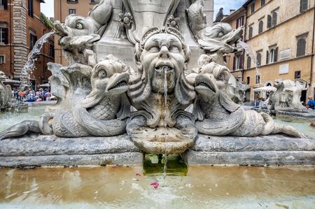 In the center of the piazza is a fountain, the Fontana del Pantheon, surmounted by an Egyptian obelisk. The fountain was constructed by Giacomo Della Porta under Pope Gregory XIII in 1575, and the obelisk was added to it in 1711 under Pope Clement XI.のeditorial素材