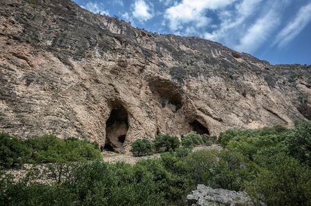 Armenia. Rocks with many grottoes and caves on the way to the monastery complex Noravank.の写真素材