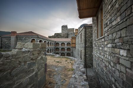 Georgia, Akhaltsikhe. Medieval, recently restored fortress Rabat, against the backdrop of the rays of the setting sun.のeditorial素材
