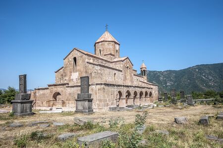 Armenia. The southern facade of the Church of the Blessed Virgin Mary of the Odzun Monastery with an external arched gallery and ancient khachkars.の写真素材