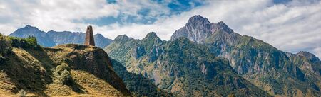 Georgia. An old watchtower on the background of the mountains near the Georgian Military Road in the...
