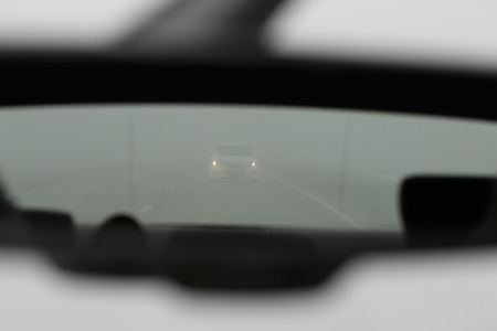 Country road in distance car with headlightsの写真素材