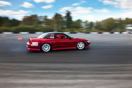 TYUMEN, RUSSIA - MAY 31, 2014: A drift racing car in action with smoking tires in hairpin bend at Russian Drift Series Ural 2014のeditorial素材