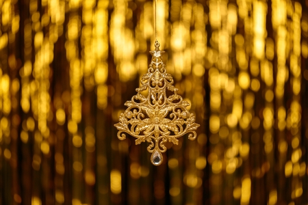 Christmas New Year Toy Fir on Gold Blur backgroundの写真素材