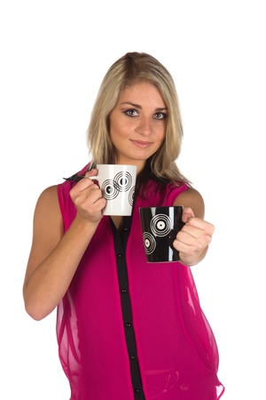 Young woman looking at camera with two coffee cups she is holding isolated on whiteの写真素材