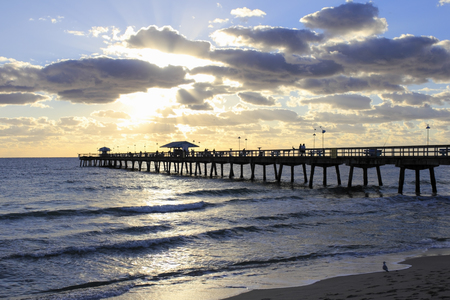 LAUDERDALE BY THE SEA, FLORIDA - FEBRUARY 2  This pier also has a restaurant, stations to clean fish, equipment for fishing, supplies and bait, on February 2, 2013 in Lauderdale-By-The-Sea, Florida のeditorial素材