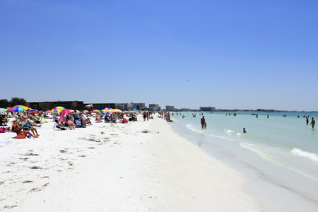 SIESTA KEY, FLORIDA - MAY 9, 2013  Many people relaxing on one of the top ten beaches in the United States, world renowned for its beauty and sand made of fine 99  pure white quartz that stays cool のeditorial素材