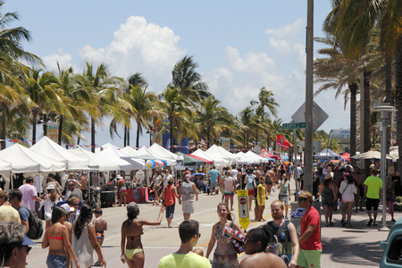 Fort Lauderdale, FL, USA - May 23, 2015: People peruse the canopy covered vendors at the Great American Beach Party. People enjoy themselves on a beach party on A1A.のeditorial素材