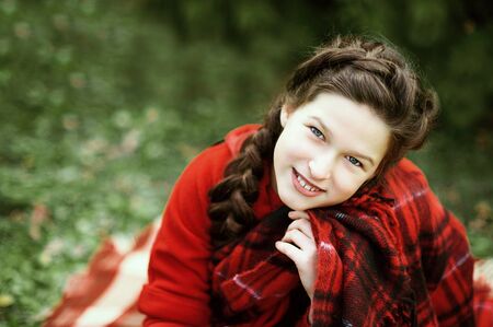 Smile girl waiting for a Christmas in the wood. Christmas in juli.