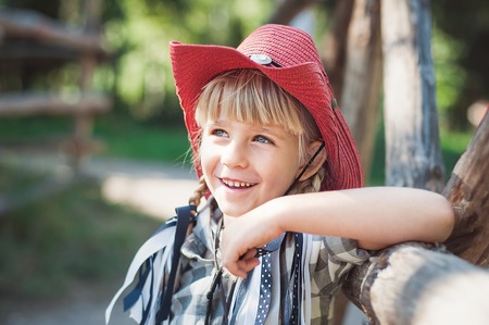 Cowboy girl. little girl in cowboy outfit on the ranchの写真素材