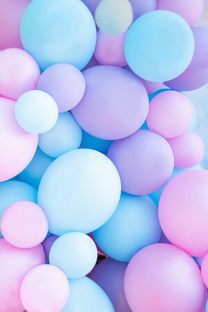 Colorful balloons background, punchy pastel colored and soft focus. pink and mint balloons photo wall birthday decorationの写真素材