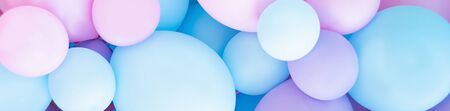 Colorful balloons background, punchy pastel colored and soft focus. pink and mint balloons photo wall birthday decorationの写真素材