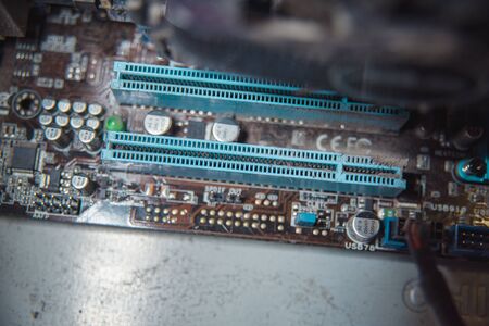 Dust on computer pc processor cooler with mainboard and computer case fragment. Selective focus....