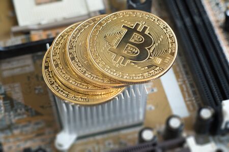 Bitcoin and motherboard. Crypto currency Gold Bitcoin, BTC, Bit Coin. Macro shot of Bitcoin...