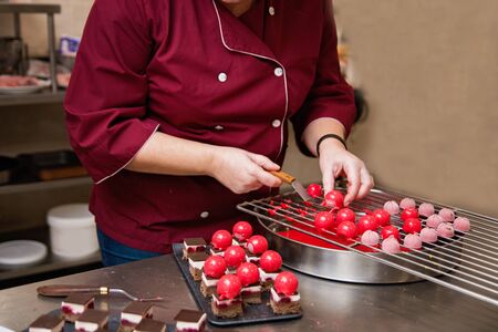 French mousse cakes with mirror glaze. Modern european dessert. Preparation of tasty mousse cake....