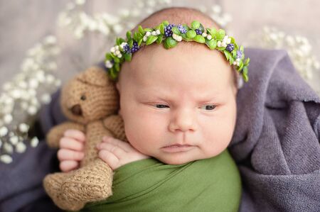 10 day old newborn baby. Beginning of life and happy fairy magic childhood concept. Closeup portrait of newborn child. spring and easter. Healthy and medical concept.の写真素材