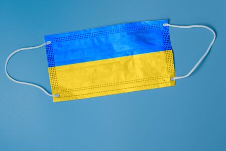 Face mask with national flag of Ukraine. concept of health care problems. Surgery concept and fight coronavirus in Ukraine. Coronavirus Covid-19 concept Pandemic. protective mask virus and flu.の写真素材
