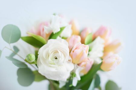 Bouquet of ranunculus of different shades. Beautiful blossoming flower. Flowers as a gift for Women's Day. Valentine's Day. March 8th. spring bannerの写真素材