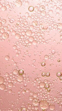 oil with bubbles on coral background. Abstract space background. Soft selective focus. macro of oil drops on water surface. copy space. air bubbles in water, Vertical format, social media readyの写真素材