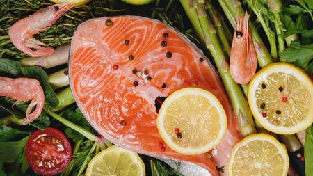 Healthy food for ketogenic diet concept on black background. Foods high in vitamins, minerals and antioxidants. Omega. Flat lay. fresh vegetables, herbs and spices. eco food delivery.の写真素材