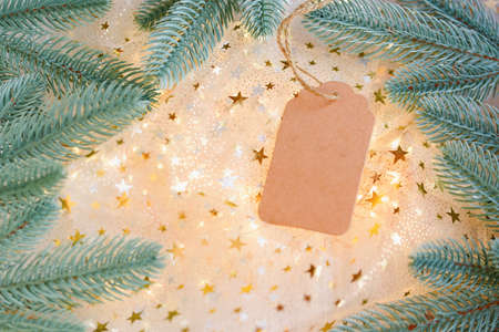 gold glitter and glittering stars on white festive background. Winter holidays background. Christmas and Happy New Year greeting card. Wedding. Birthday. selective focusの写真素材