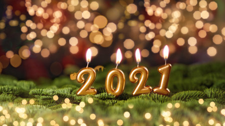 Holiday background Happy New Year 2021. Numbers of year 2021 made by gold burning candles on bokeh festive sparkling background. celebrating New Year holiday, close-up. Space for textの写真素材
