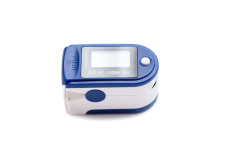 Portable blue Pulse Oximeter on isolated white background with clipping path to monitor oxygen level at home. Covid-19, healthcare concept. Pulse Rate Health Tester is used to measure air in lungs.の写真素材