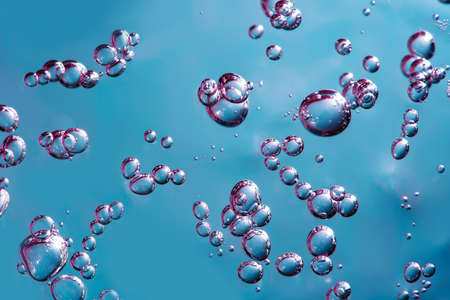 Close up macro Aloe vera gel serum cosmetic texture blue and pink background with bubbles. Cruelty...