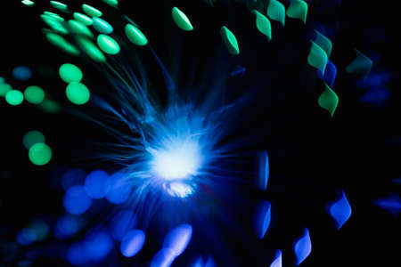 abstract blue on black bokeh background overlay layer. sparks and blowing. festive background....