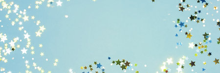 Holiday Festive background. gold and silver star confetti glitter scattered on blue background....