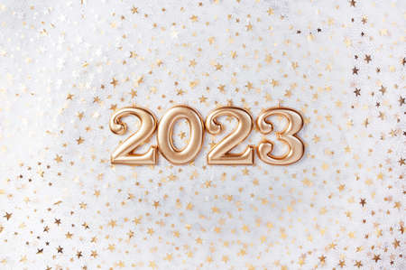 Holiday background Happy New Year 2023. Numbers of year 2023 made by gold candles on bokeh festive sparkling background. celebrating New Year holiday, close-up. Space for textの写真素材