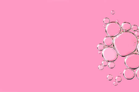 Close up macro Aloe vera gel cosmetic texture pink background with bubbles. Lemongrass gel skincare...