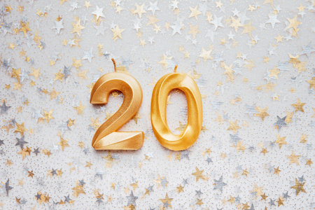 Number 20 twenty golden celebration birthday candle on Festive Background. twenty years birthday. concept of celebrating birthday, anniversary, important date, holidayの写真素材
