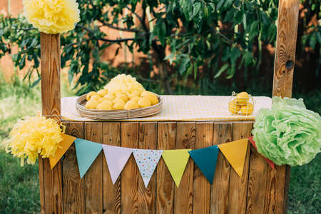 Plate with ripe fresh lemons. Vitamins concept. copy space. Strengthening immunity concept. Tropical fruit. Organic citrus fruits for a healthy diet.の写真素材