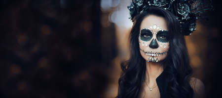 Closeup portrait of Calavera Catrina in black dress. Sugar skull makeup. Dia de los muertos. Day of The Dead. Halloween.の写真素材