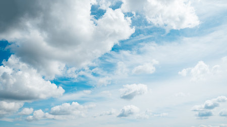 Panoramic Blue Sky with light fluffy clouds banner background. Wide Angle Natural Wallpaper With...