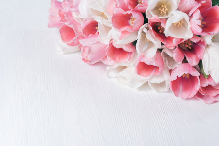 greeting card for spring holiday Happy mothers day composition. Beautiful background of bouquet of pink and white tulips. perfect for romantic themes, wedding invitations, and feminine branding.の写真素材