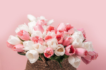 greeting card for spring holiday Happy mothers day composition. Beautiful background of bouquet of pink and white tulips. perfect for romantic themes, wedding invitations, and feminine branding.の写真素材