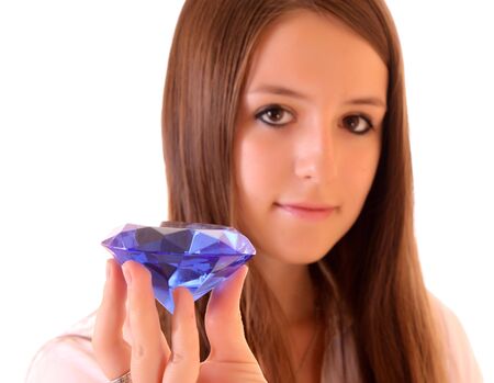 Young woman with diamond isolated on whiteの写真素材