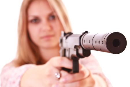 Young woman with pistol on white backgroundの写真素材