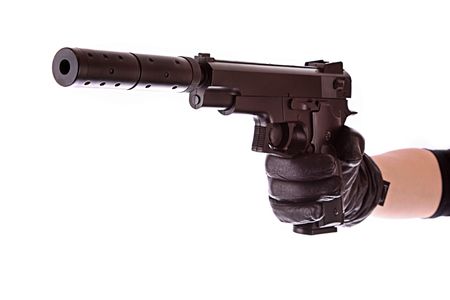 Pistol on black glove isolated on white