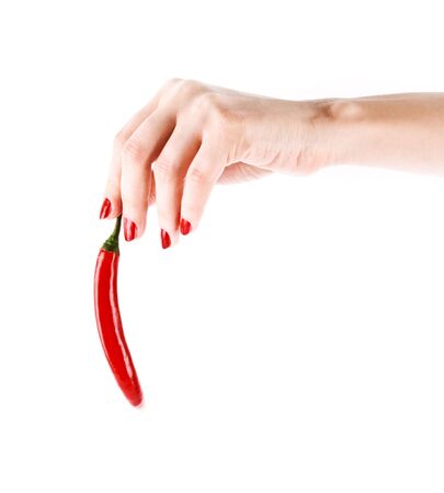 Red chilly pepper in hand isolated on whiteの写真素材