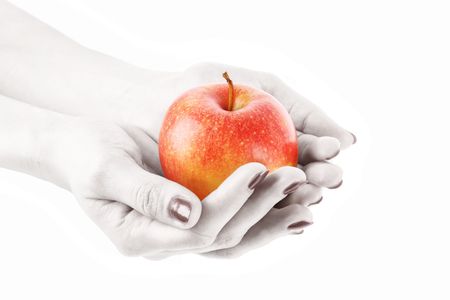 An apple on the hand isolated on white
. Black and white handsの写真素材