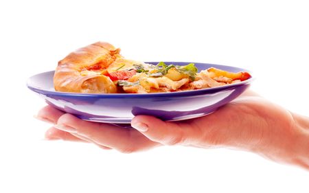 Pizza on plate with hand isolated on whiteの写真素材