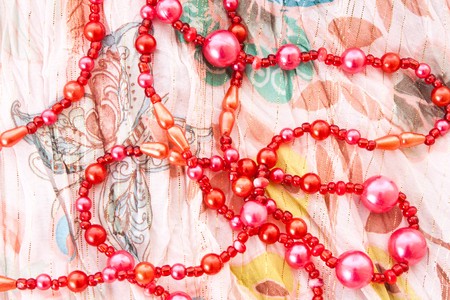 red chaplet on textile backgroundの写真素材